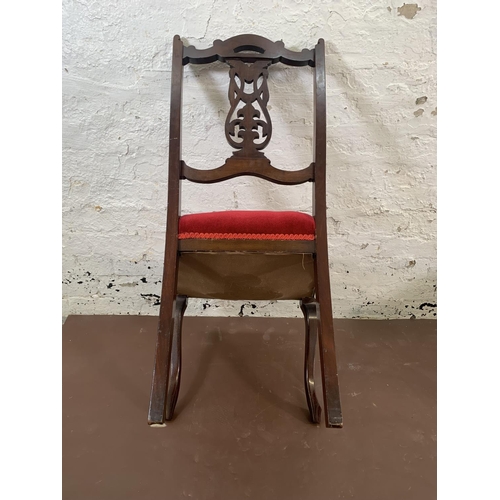 70 - Four Edwardian carved mahogany and red fabric upholstered dining chairs