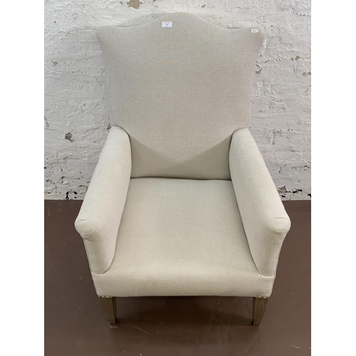 75 - An Edwardian fabric upholstered moustache top armchair - approx. 96cm high x 66cm wide x 66cm deep
