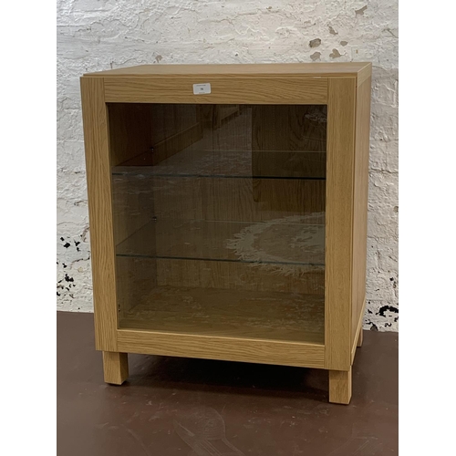 78 - An IKEA oak effect display cabinet - approx. 75cm high x 60cm wide x 42cm deep