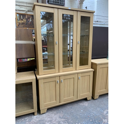 80 - A Woodberry Bros & Haines Ltd oak effect display cabinet - approx. 194cm high x 121cm wide x 40cm de... 