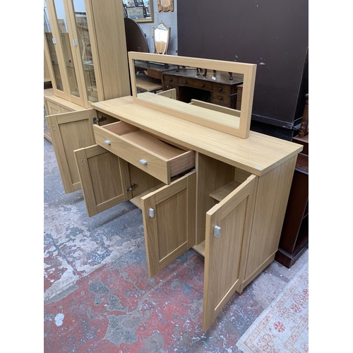 81 - Two pieces of oak effect furniture, one Woodberry Bros & Haines Ltd sideboard - approx. 89cm high x ... 