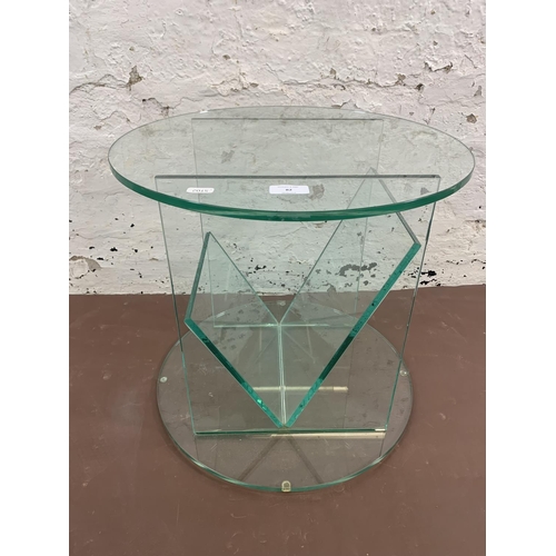 82 - A contemporary glass circular side table - approx. 42cm high x 45cm diameter