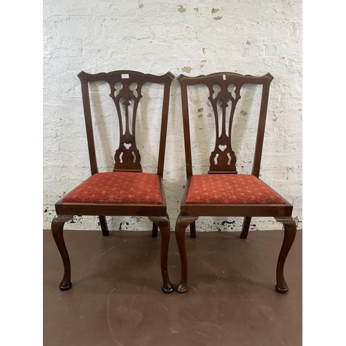 85 - A pair of late 19th/early 20th century carved mahogany and fabric upholstered dining chairs