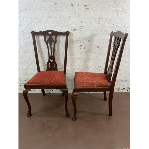 85 - A pair of late 19th/early 20th century carved mahogany and fabric upholstered dining chairs