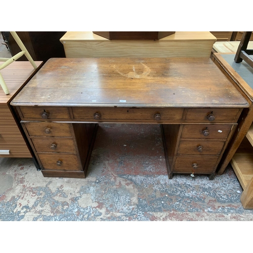 86 - A Victorian oak twin pedestal writing desk - approx. 75cm high x 142cm wide x 76cm deep