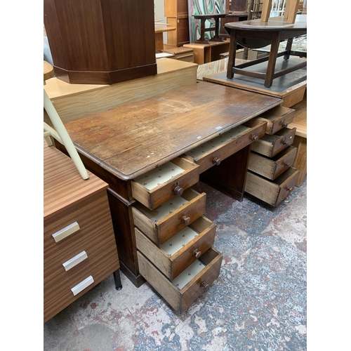 86 - A Victorian oak twin pedestal writing desk - approx. 75cm high x 142cm wide x 76cm deep