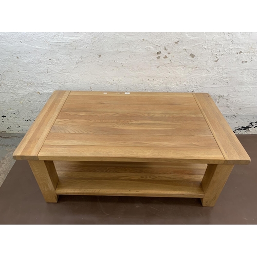 87 - A modern solid oak rectangular two tier coffee table - approx. 50cm high x 70cm wide x 120cm long