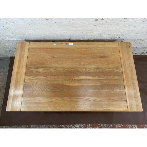87 - A modern solid oak rectangular two tier coffee table - approx. 50cm high x 70cm wide x 120cm long