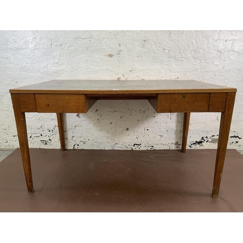 88 - A 1950s oak desk with grey painted writing surface, believed to be designed for the M.O.D. - approx.... 