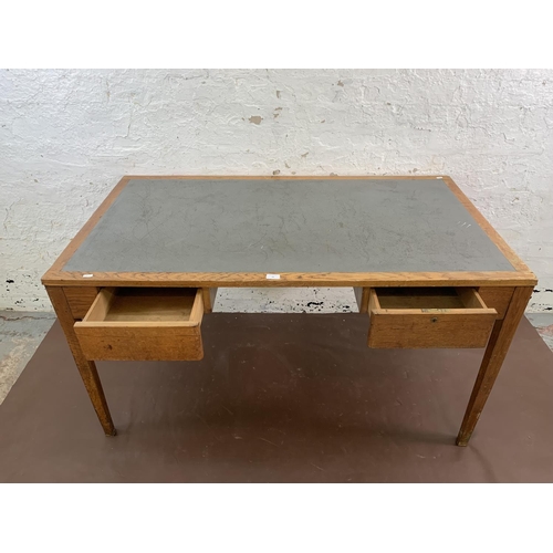 88 - A 1950s oak desk with grey painted writing surface, believed to be designed for the M.O.D. - approx.... 