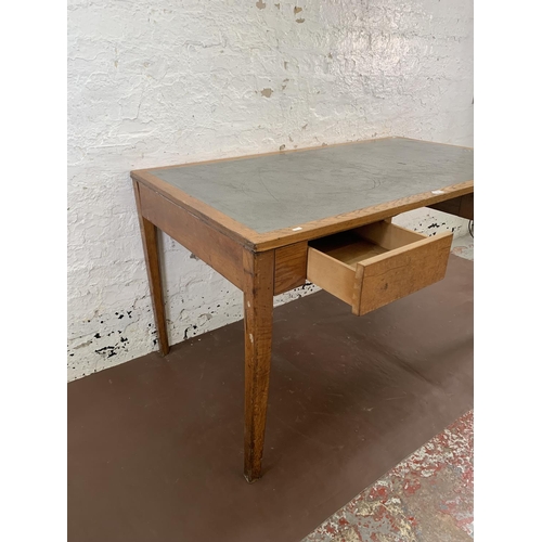 88 - A 1950s oak desk with grey painted writing surface, believed to be designed for the M.O.D. - approx.... 