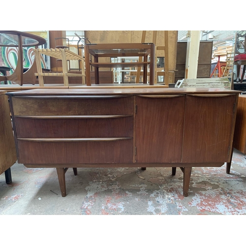 96 - A mid 20th century teak sideboard - approx. 74cm high x 137cm wide x 43cm deep