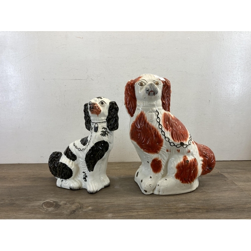 502 - Two Staffordshire King Charles Spaniel figurines, one 19th century and one later - largest approx. 3... 