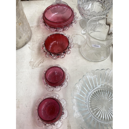 510 - A collection of antique and later glassware to include Edwardian decanter, five pieces of cranberry ... 