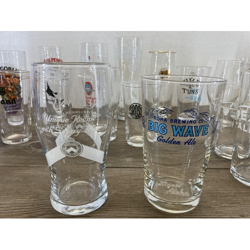 511 - A collection of branded beer glasses to include Hobgoblin, San Miguel, Hogshead etc.