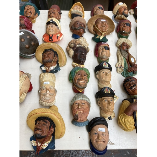 517 - Approx. eighty vintage Bossons chalkware head wall masks to include Chef, Spanish Lady, Snake charme... 