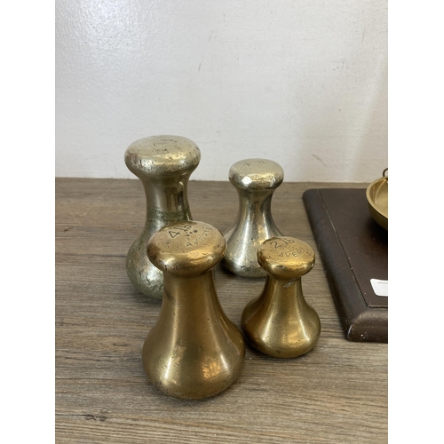 519 - A set of 19th century brass balance scales on stained mahogany base - approx. 59cm high x 53cm wide ... 