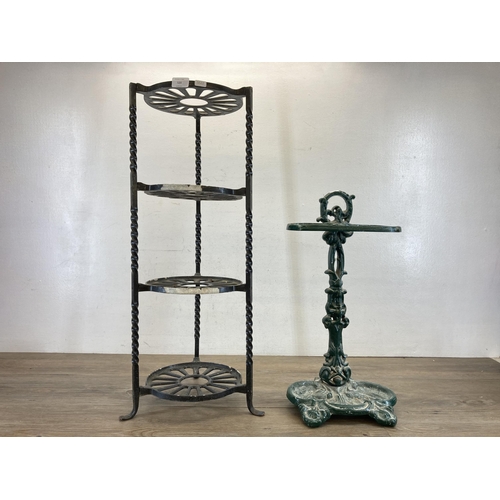 520 - Two wrought iron items, one black painted four tier kitchen pan stand - approx. 77cm high and one 19... 