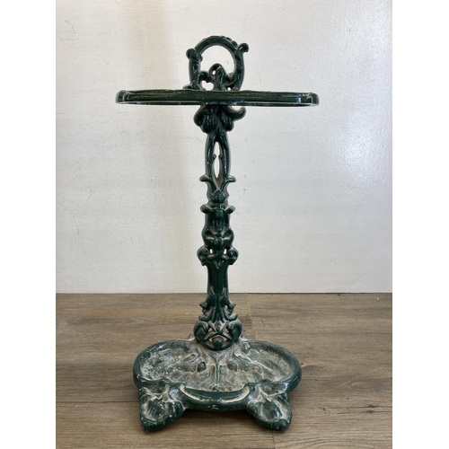 520 - Two wrought iron items, one black painted four tier kitchen pan stand - approx. 77cm high and one 19... 