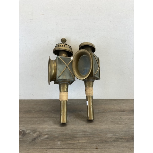 523 - A pair of early 20th century brass carriage lanterns - approx. 48cm high