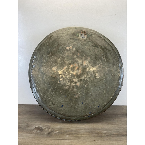 529 - A large early 20th century copper tray/charger - approx. 65cm diameter