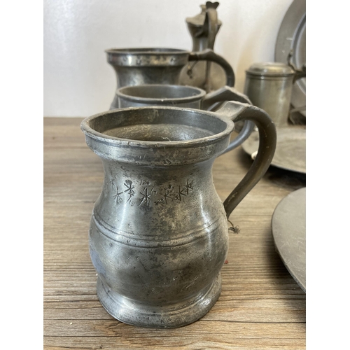 531 - A collection of 19th century and later pewter to include dinner plates, tankards etc.