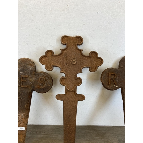 533 - Nine 19th century gothic revival cast iron grave markers, eight reserved and one number 18