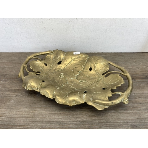 544 - Four pieces of metalware comprising Art Nouveau style brass leaf designed two handled shallow bowl, ... 