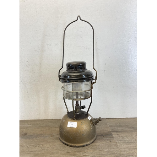 547 - Two items, one vintage gold painted and black enamel paraffin lantern and one cast iron shoe last