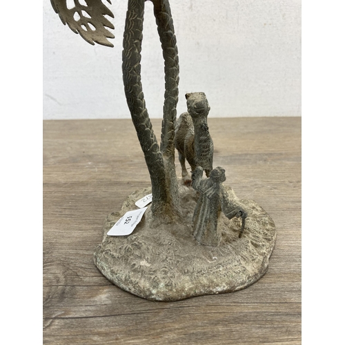 552 - An early 20th century middle eastern cast brass camel and owner under palm tree sculpture - approx. ... 