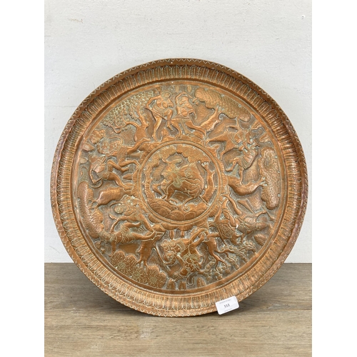 553 - An early 20th century Indian embossed copper wall charger approx. 47cm diameter