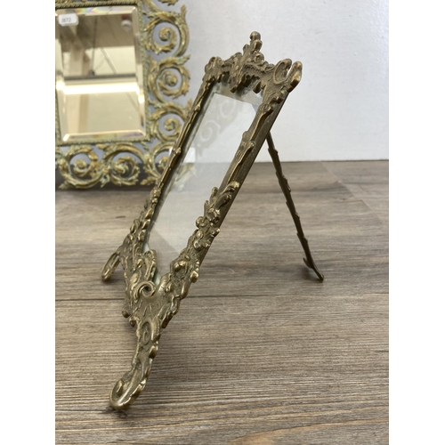 555 - Two brass framed items, one 19th century bevelled edge mirror - approx. 40cm high x 26cm wide and on... 