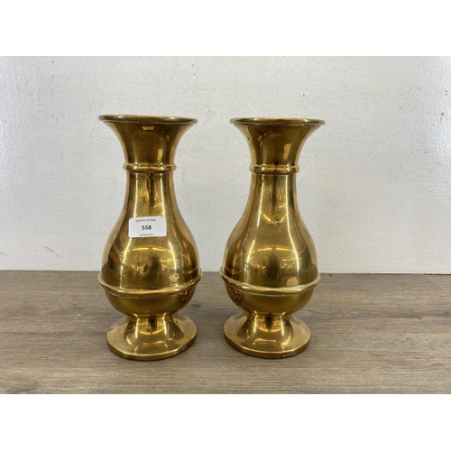 558 - A pair of 19th century brass John Smyth & Sons (Dublin) Ltd. ecclesiastical engraved vases - approx.... 