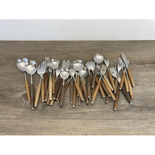 562 - A collection of 1960s Wallin Brothers of Sweden 'Safir' teak and stainless steel cutlery