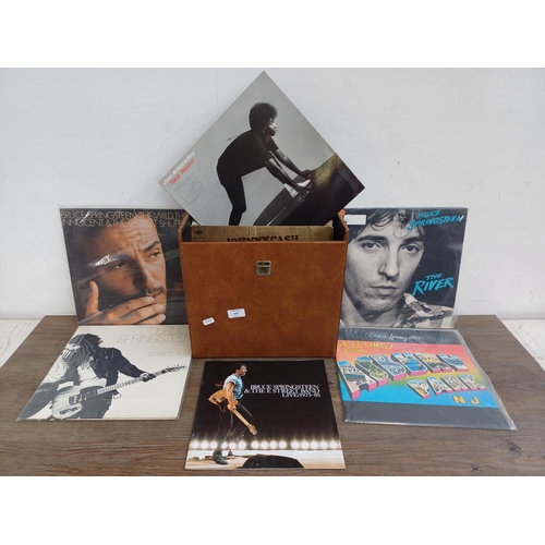 904 - A record case containing a collection of vinyl records to include Bruce Springsteen, Joan Armatradin... 