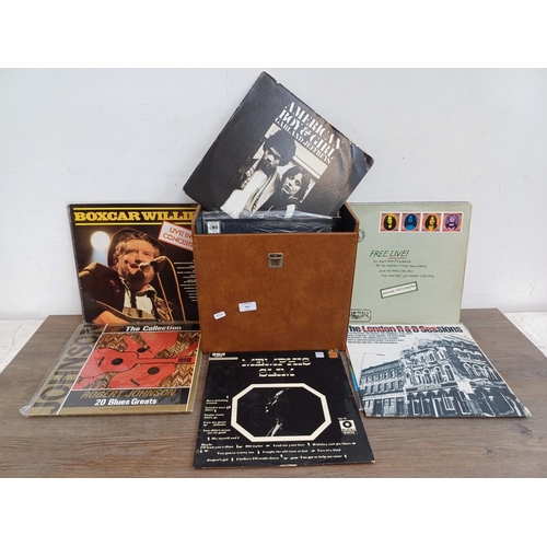 904 - A record case containing a collection of vinyl records to include Bruce Springsteen, Joan Armatradin... 