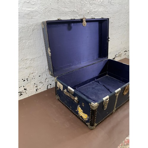198 - A mid 20th century blue painted and metal banded travel trunk - approx. 36cm high x 92cm wide x 54cm... 