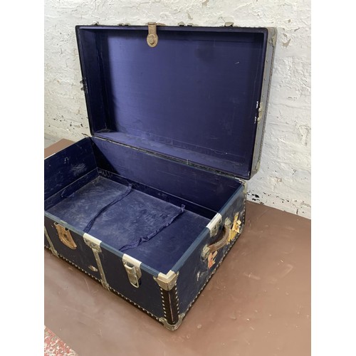 198 - A mid 20th century blue painted and metal banded travel trunk - approx. 36cm high x 92cm wide x 54cm... 