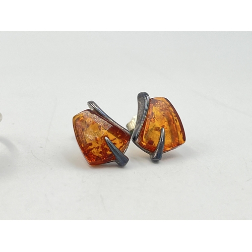 2008 - Three pieces of silver amber set jewellery, one solitaire ring, one pendant and one pair of earrings... 