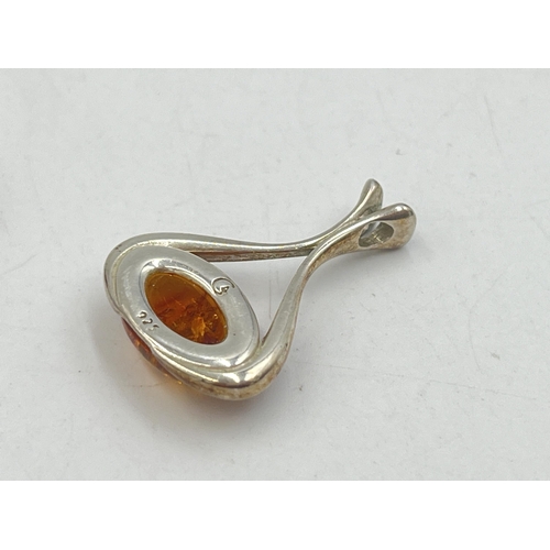 2008 - Three pieces of silver amber set jewellery, one solitaire ring, one pendant and one pair of earrings... 