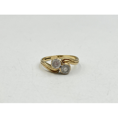 2016 - A hallmarked Birmingham 9ct gold CZ two stone twist setting ring, size M - approx. gross weight 2.4g