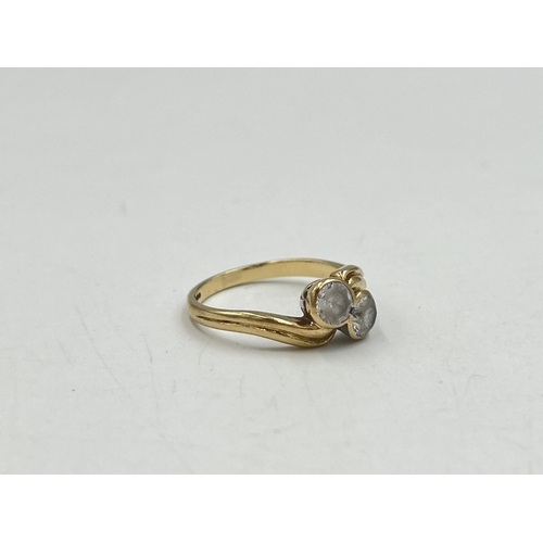 2016 - A hallmarked Birmingham 9ct gold CZ two stone twist setting ring, size M - approx. gross weight 2.4g