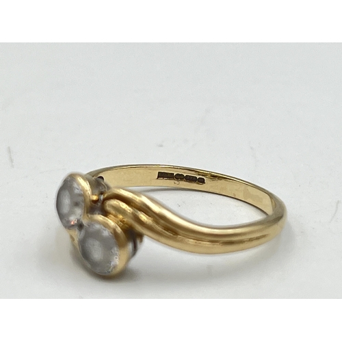 2016 - A hallmarked Birmingham 9ct gold CZ two stone twist setting ring, size M - approx. gross weight 2.4g