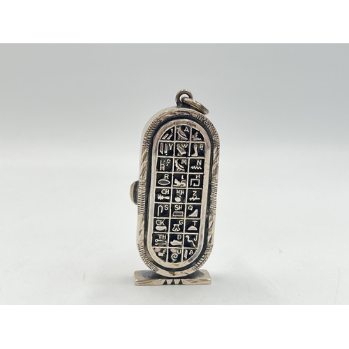 2022 - An Egyptian silver hieroglyphic design pendant/trinket box - approx. gross weight 25.4g