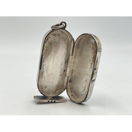 2022 - An Egyptian silver hieroglyphic design pendant/trinket box - approx. gross weight 25.4g