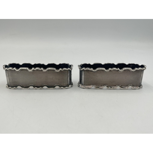 2034 - A pair of E. Hill hallmarked Birmingham silver napkin rings, dated 1956 - approx. gross weight 71g