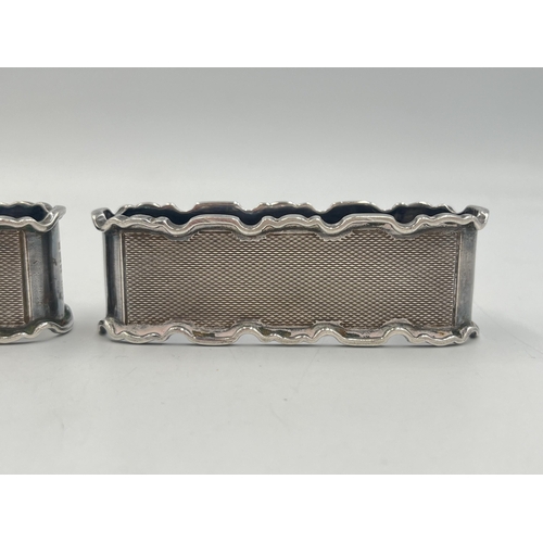 2034 - A pair of E. Hill hallmarked Birmingham silver napkin rings, dated 1956 - approx. gross weight 71g