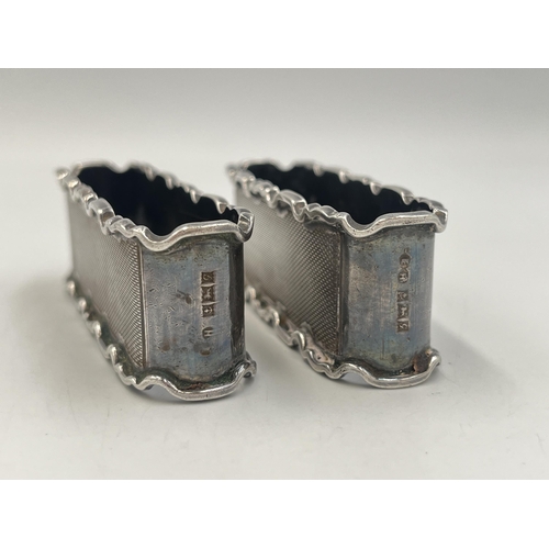 2034 - A pair of E. Hill hallmarked Birmingham silver napkin rings, dated 1956 - approx. gross weight 71g