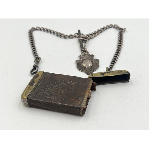 2040 - An early 20th century brass vesta case with fitted hallmarked sterling silver Albert chain, T-bar an... 