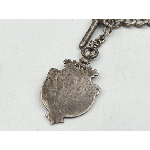 2040 - An early 20th century brass vesta case with fitted hallmarked sterling silver Albert chain, T-bar an... 